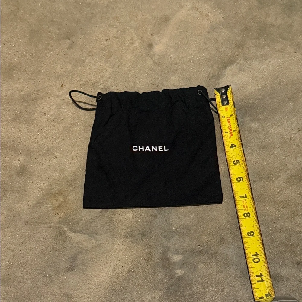 Authentic CHANEL Black Drawstring Pouch with White Logo
